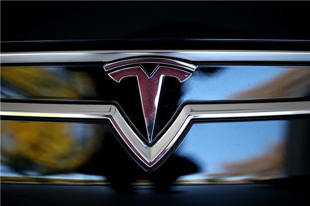 特斯拉標誌(圖：AFP)