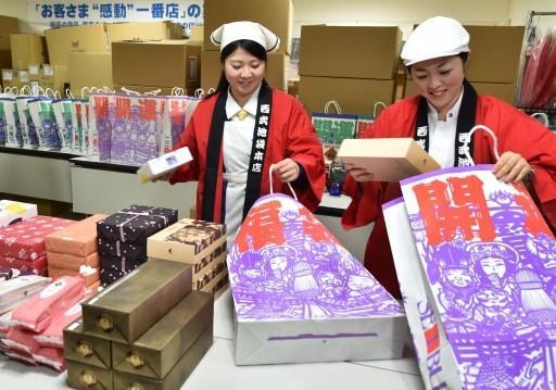 日本11月份零售銷售年升0.4%      (圖:AFP)