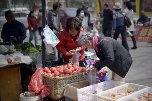 北京街頭小販      (圖:AFP)
