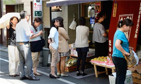 外界關注日本通膨目標是否能夠達成(圖：AFP)