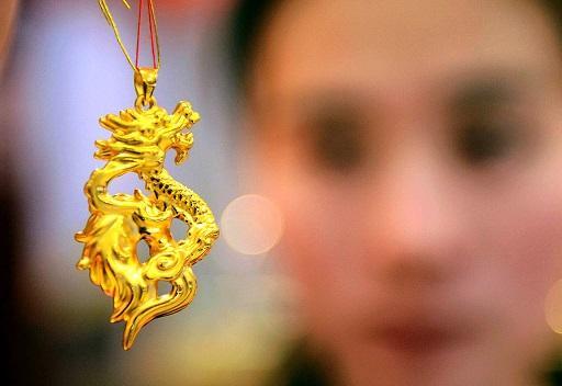 全球首季的黃金需求下滑 金價要回升恐有難度 (圖: AFP)