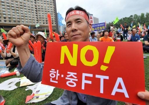 雖然南韓部分民眾反對，但中國和南韓已正式簽署FTA      (圖:AFP)
