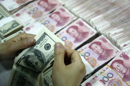 美元與人民幣 未來持續影響全球經濟 (圖:AFP)
