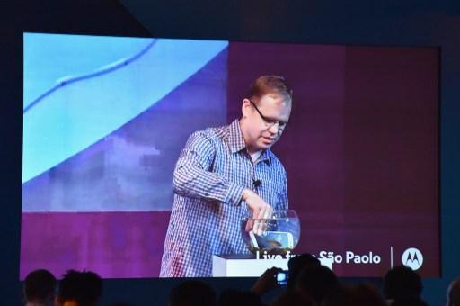 Steve Sinclair, Motorola Vice President of Product Marketing, demonstrates advanced water resistance on the new Moto G smartphone from a global Livestream event in Sao Paulo, Brazil on July 28, 2015