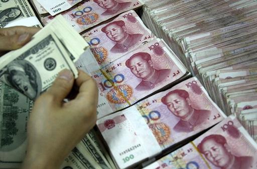 人民幣重貶恐引起全球通縮壓力 (圖: AFP)