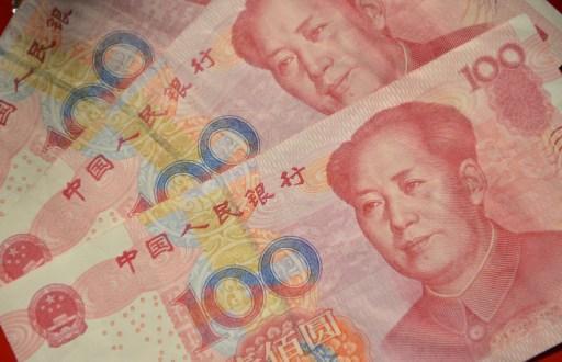 人民幣兩日來中間價調降3.5%(圖：AFP)