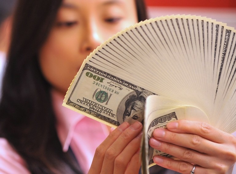 美國經濟不佳打壓美元漲勢。(來源：AFP)