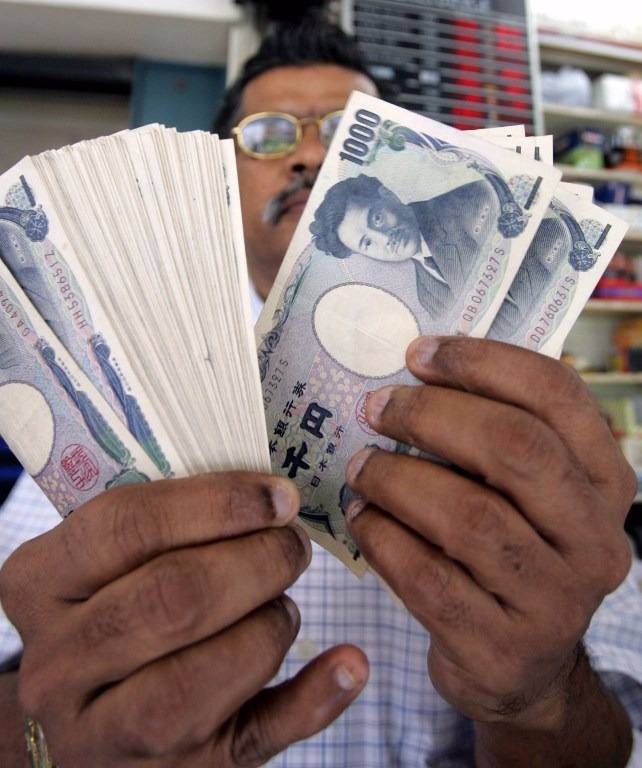 榊原英資表示，新刺激計劃不足以制止日元升勢，料日元兌每美元將逐漸升至100水平。 (圖：AFP)