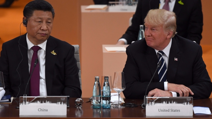 美國總統川普與中國領導人習近平今年 7 月出席 G20 峰會。(AFP)