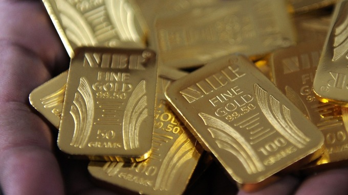 貴金屬盤後─預期放寬貨幣政策 黃金收高12.90美元 創逾六年收盤高點 (圖片：AFP)