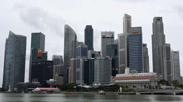 新加坡基準利率降到近零水準，似乎正朝負利率陣營靠攏。(圖:AFP)