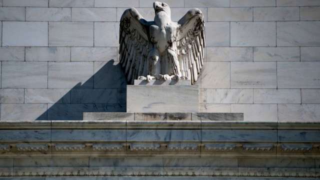 加碼刺激!Fed 宣布購買個別公司債 助力道瓊盤中反彈 (圖片:AFP)