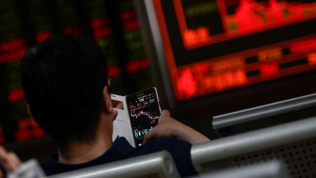 美貨幣寬鬆短期不易改變 台幣資金氾濫 台股續創新高氣氛濃。(圖:AFP)