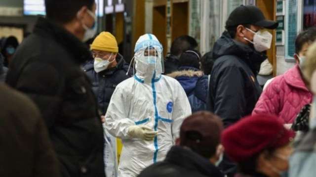 因應疫情升溫 18家銀行陸續啟動居家辦公。(圖:AFP)