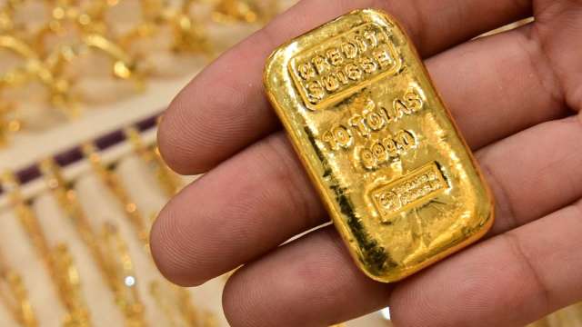 〈貴金屬盤後〉黃金收登關鍵心理價位1800美元以上 今年2月來最高水準 (圖片:AFP)