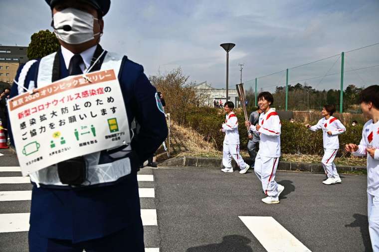 日本逾 23 萬人聯名請願停辦奧運 (圖片:AFP)