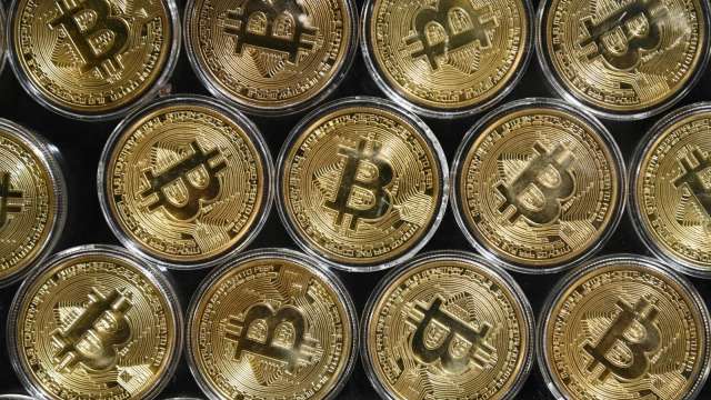 比特幣10月上漲30%改寫5月紀錄 市場看好價格有望重返歷史新高(圖片:AFP)