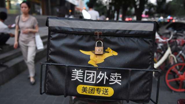 服從反壟斷 快手與美團宣布合作(圖片:AFP)