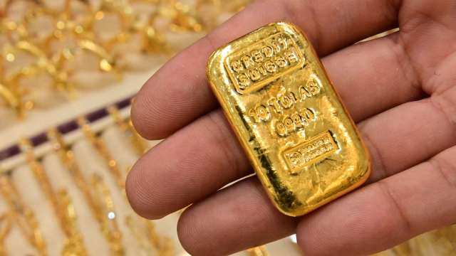 〈貴金屬盤後〉黃金走低開啟2021最末週  但守住關鍵1800美元(圖片:AFP)