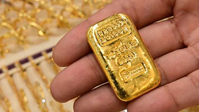 〈貴金屬盤後〉歲末避險買盤湧現 美元上漲 黃金仍收高 (圖片:AFP)