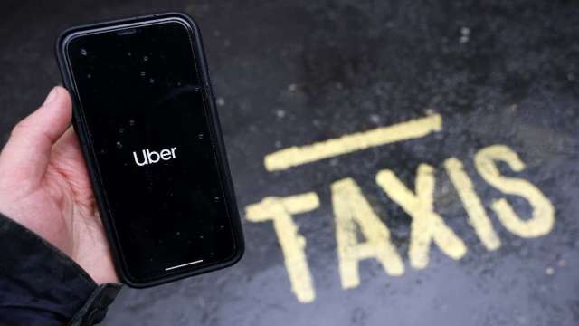 Uber開放手機軟體可電召計程車。（圖：AFP）