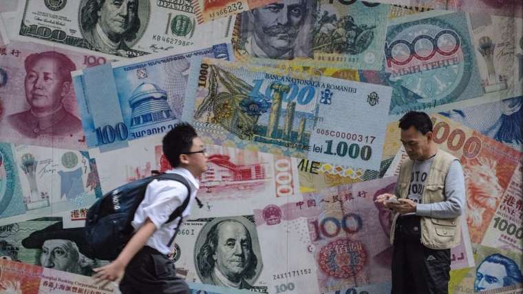 亞洲央行升息打通膨，並藉此支撐本國貨幣，降低資金外流衝擊。(圖: AFP)