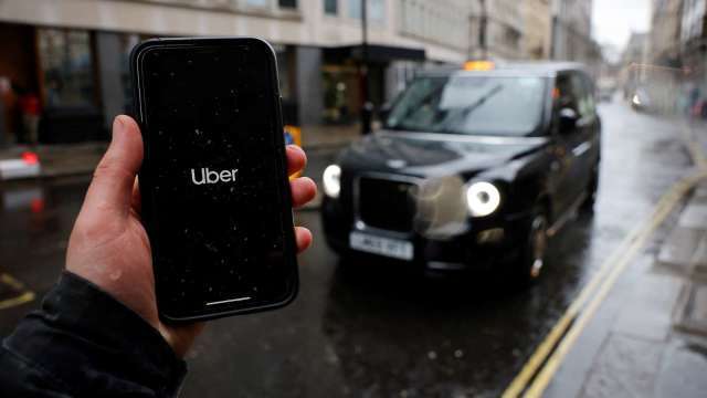 美國疫情趨緩 Uber宣布司機與乘客可不用戴口罩(圖片:AFP)
