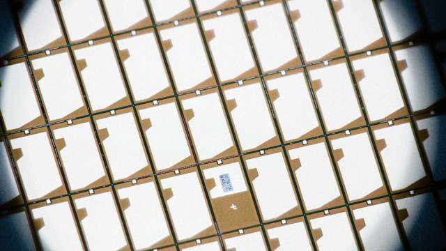 長電搶進先進封裝 宣布完成4奈米手機晶片封裝。(圖:AFP)