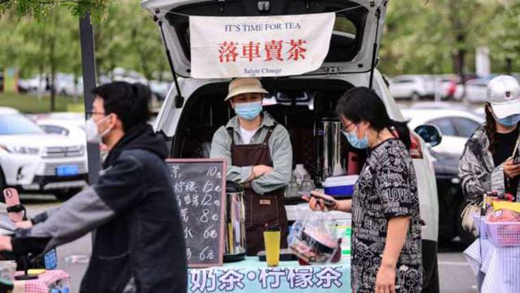 中国十一长假登场，民众仍被要求就地过节，难以刺激消费。(图: AFP)(photo:CnYes)
