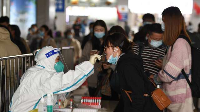 鄭州、北京、廣州允許部分人員不必參加全民檢測。(圖: AFP)