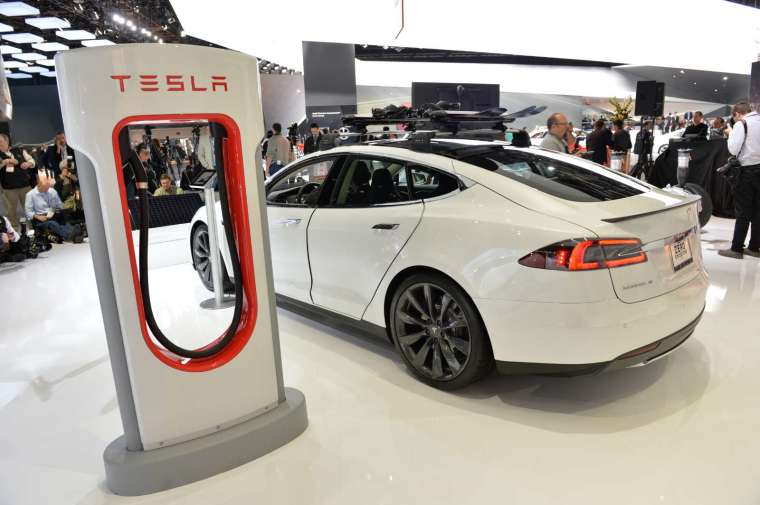 Experts advise people not to buy Tesla cars (Image: AFP)