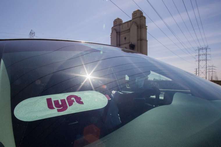 At least seven analysts downgraded Lyft stock, Barron's reports (Pic: AFP)