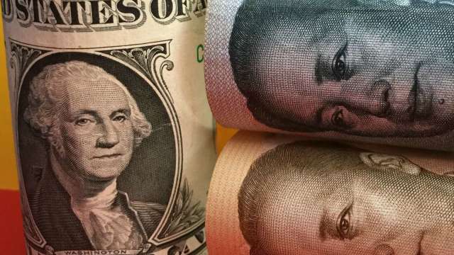 近三年新高！中國離岸人民幣兌美元升破6.9大關(圖:shutterstock)